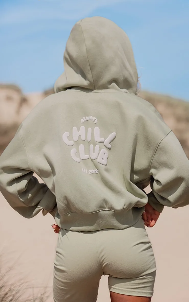 Veste vert pistache imprimé 'Chill Club' en relief à zip